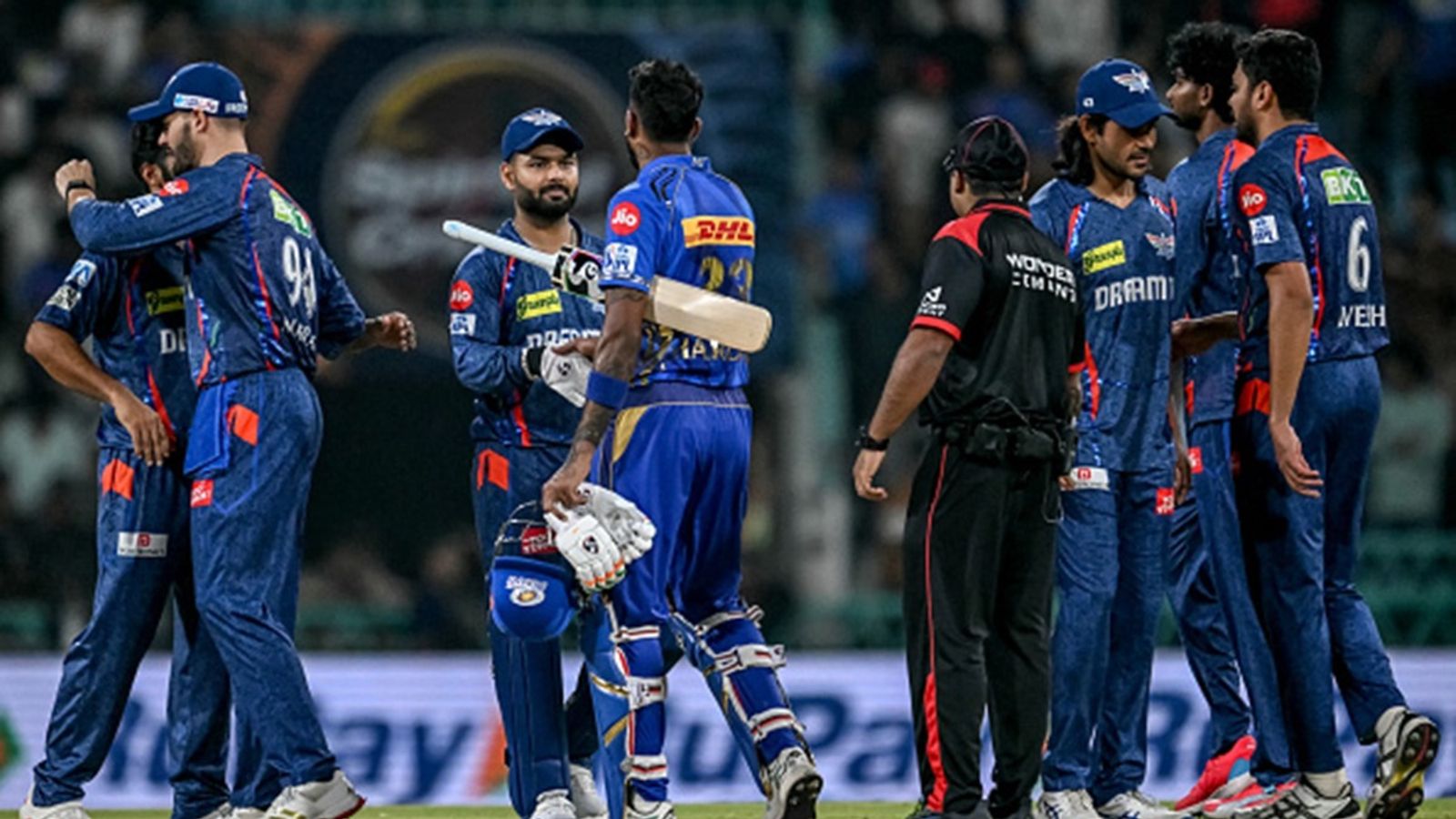 MI vs LSG Match Prediction: Mumbai Indians have momentum by their side but Lucknow Super Giants remain dominant against 5-time IPL champions Mumbai Indians' captain Hardik Pandya (C) shakes hands with his Lucknow Super Giants' counterpart Rishabh Pant (3L) at the end of the Indian Premier League (IPL) match at the Ekana Cricket Stadium in Lucknow on April 4, 2025.