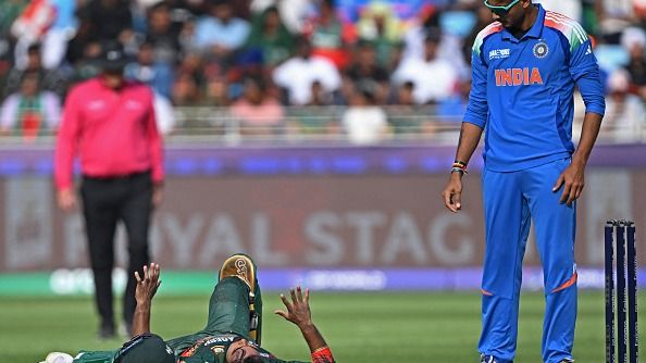 Bangladesh's 24-year-old star handed four-match ban with immediate effect Bangladesh's Towhid Hridoy lies on the ground after playing a shot as India's Axar Patel (R) watches on in this frame