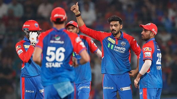 Axar Patel of Delhi Capitals (2nd R) celebrates after taking the wicket of Venkatesh Iyer of Kolkata Knight Riders during the 2025 IPL match between Delhi Capitals and Kolkata Knight Riders