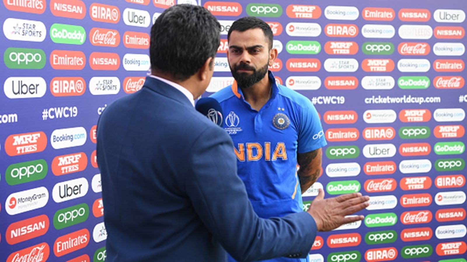 Virat Kohli's brother reminds Sanjay Manjrekar of his ODI strike rate, says 'Easy to talk about 200 plus...' ICC Commentator Sanjay Manjrekar interviews Virat Kohli of India during the Group Stage match of the ICC Cricket World Cup 2019 between Sri Lanka and India at Headingley on July 06, 2019 in Leeds, England.