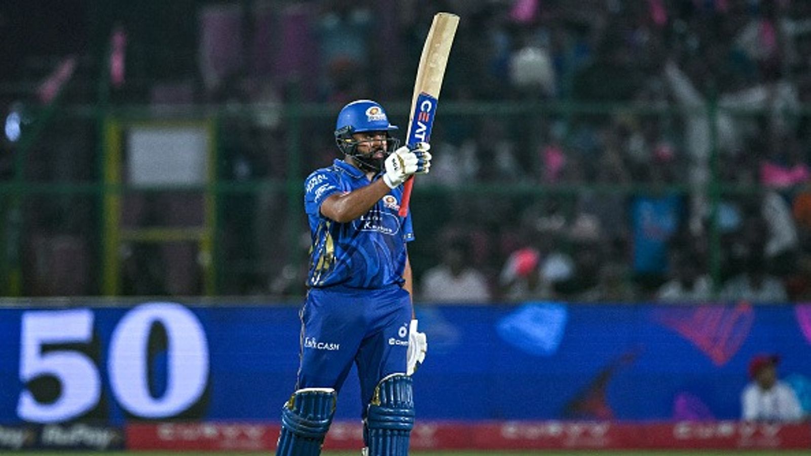 'For so many years that people are after him': Ex-RCB star slams Rohit Sharma's critics after MI's 100-run win against RR Rohit Sharma celebrates after scoring a half-century (50 runs) during the Indian Premier League (IPL) Twenty20 cricket match between Rajasthan Royals and Mumbai Indians