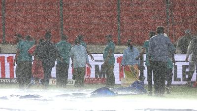 IPL 2025: Know SRH's target against DC if rain-affected match turns out to be a five-over chase The ground staff work to keep the pitch dry as play is delayed due to rain during the 2025 IPL match between SRH vs DC at Rajiv Gandhi International Stadium