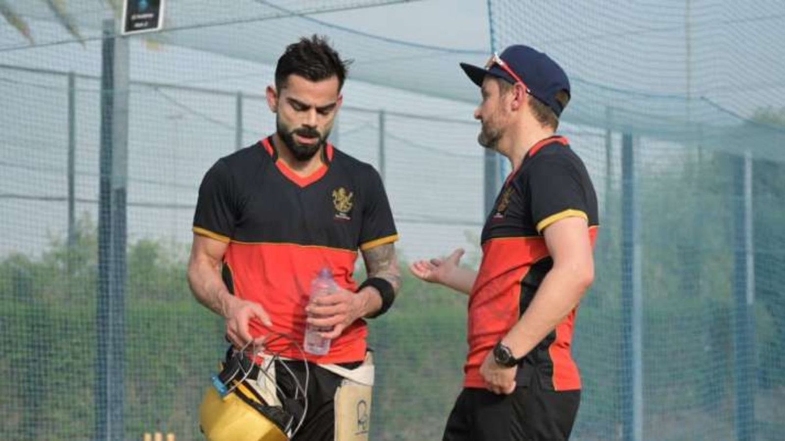 Former RCB coach appointed as 8th-ranked Pakistan T20I team's white-ball head coach ahead of Bangladesh series RCB's Virat Kohli with former head coach Mike Hesson during a training session.