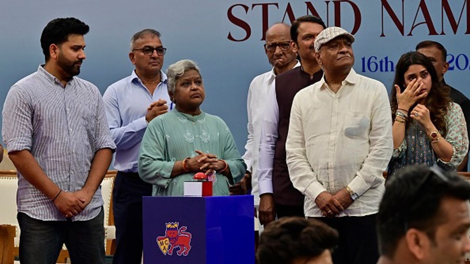 'Used to come from train just to get a glimpse of this stadium...': Emotional Rohit Sharma recalls old days as a stand named after him unveils at Wankhede Stadium, Watch VIDEO Indian Cricketer Rohit Sharma along with his mother Poornima, father Gurunath and wife Ritka, Maharashtra CM Devendra Fadnavis and Sharad Pawar during stand naming ceremony as Rohit Sharma Stand at Wankhede Stadium