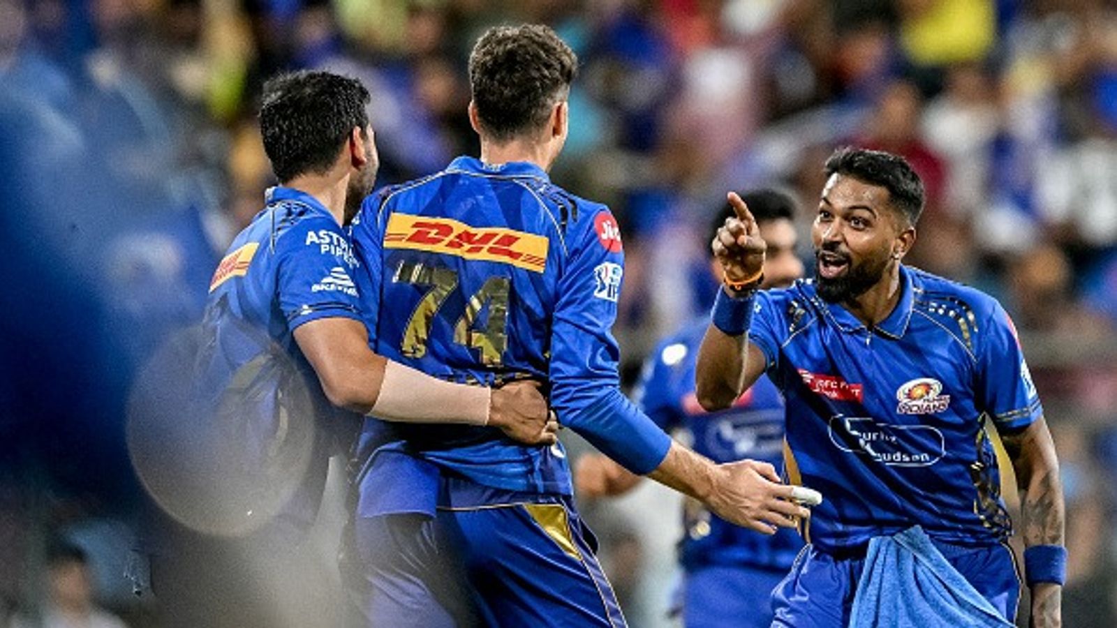Suryakumar Yadav stars with the bat, bowlers seal the deal as Mumbai Indians storm into IPL 2025 playoffs after registering a 59-run win against Delhi Capitals Mumbai Indians' Mitchell Santner (C) celebrates with captain Hardik Pandya (R) after taking the wicket of Delhi Capitals' Ashutosh Sharma during the Indian Premier League (IPL)