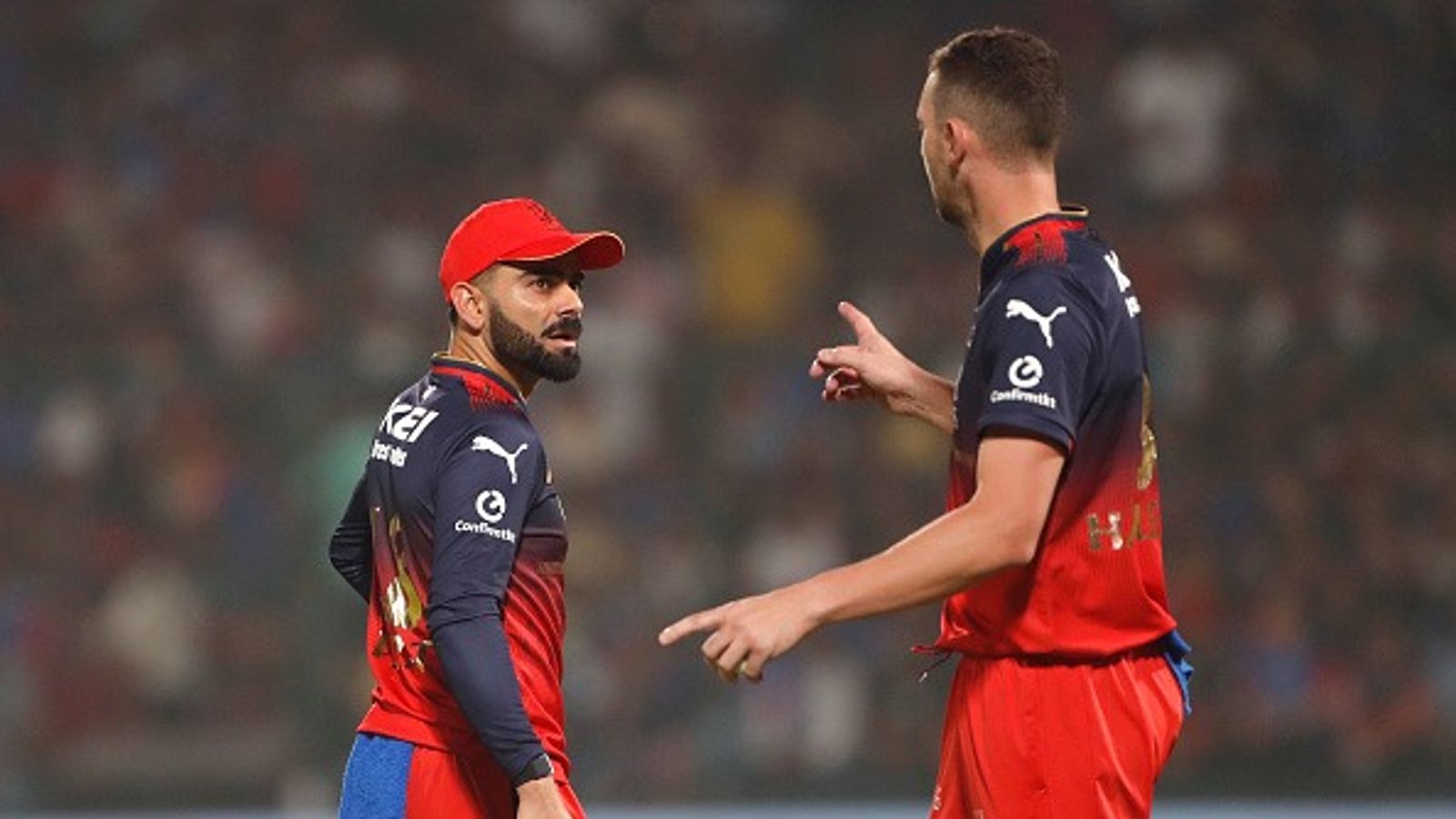 WATCH: Big boost for RCB, Josh Hazlewood joins squad ahead of IPL 2025 clash against LSG Virat Kohli of Royal Challengers Bengaluru (L) and Josh Hazlewood of Royal Challengers Bengaluru during the 2025 IPL match between Delhi Capitals and Royal Challengers Bengaluru