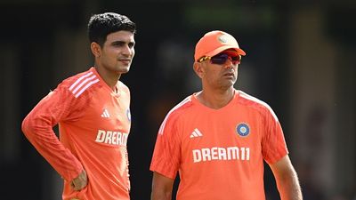 BCCI's MAJOR U-turn - Sacked coach set to travel England alongside India, Shubman Gill to miss warm-up match ahul Dravid, Coach of India speaks with Shubman Gill of India during the ICC Men's Cricket World Cup India 2023 India Net Session at M. Chinnaswamy Stadium on November 08, 2023 in Bangalore, India.