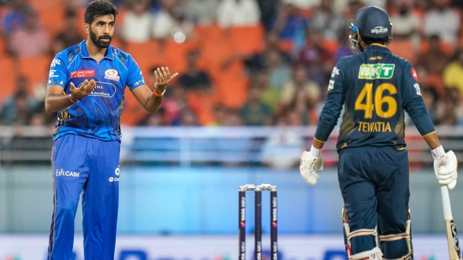 'Mereko mat bol...': What transpired between Jasprit Bumrah and Rahul Tewatia during heated exchange in GT vs MI IPL 2025 Eliminator? MI's Jasprit Bumrah (L) and GT's Rahul Tewatia in frame