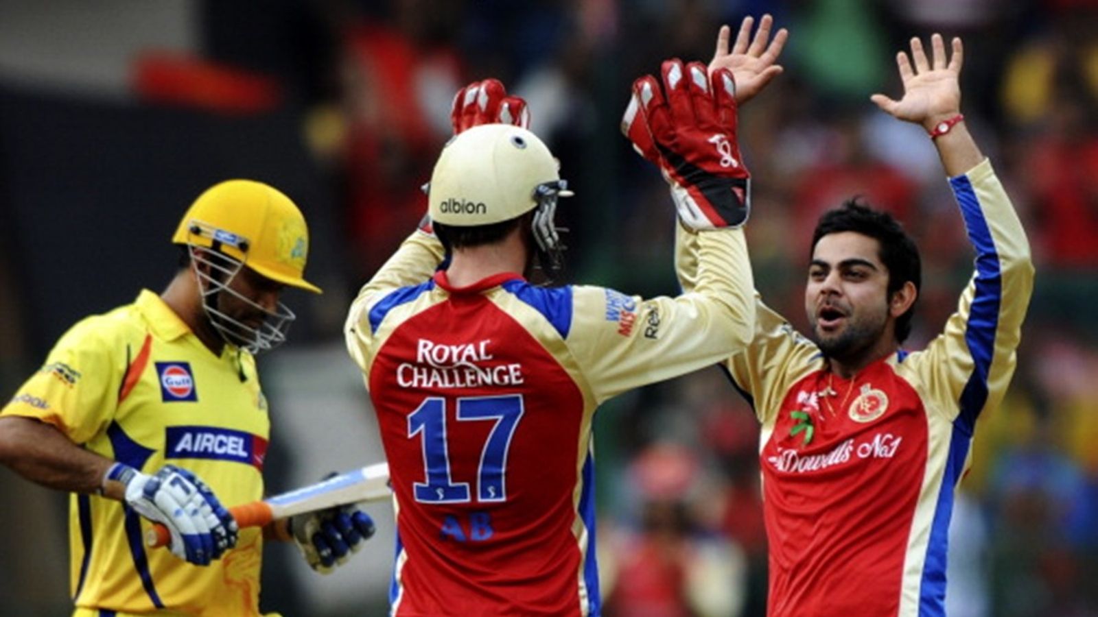'He doesn't listen to me. He can't help but show that...': AB de Villiers recalls asking Virat Kohli to tone down emotions on field Royal Challengers Bengaluru's Virat Kohli (L) celebrates with teammate AB De Villiers after taking the wicket of Chennai Super Kings batsman Wriddhiman Saha as Mahendra Singh Dhoni looks on during the IPL 2011.