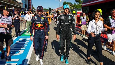 George Russell Makes Scathing Claim After Max Verstappen Collision at Spanish GP, 'It felt very deliberate' Max Verstappen of Netherlands and Oracle Red Bull Racing walks in pit lane with George Russell of Great Britain
