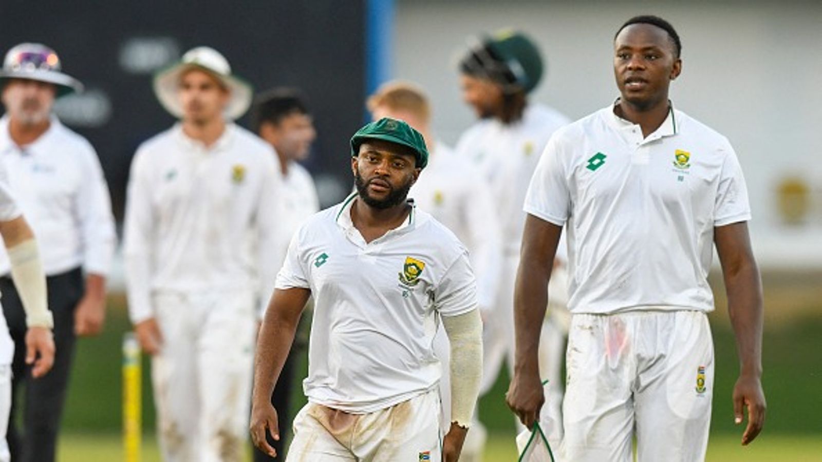 'It’s been a couple of weeks now...': Temba Bavuma addresses Kagiso Rabada's drug ban ahead of WTC final against Australia Temba Bavuma (C) and Kagiso Rabada (R) of South Africa walk off the field