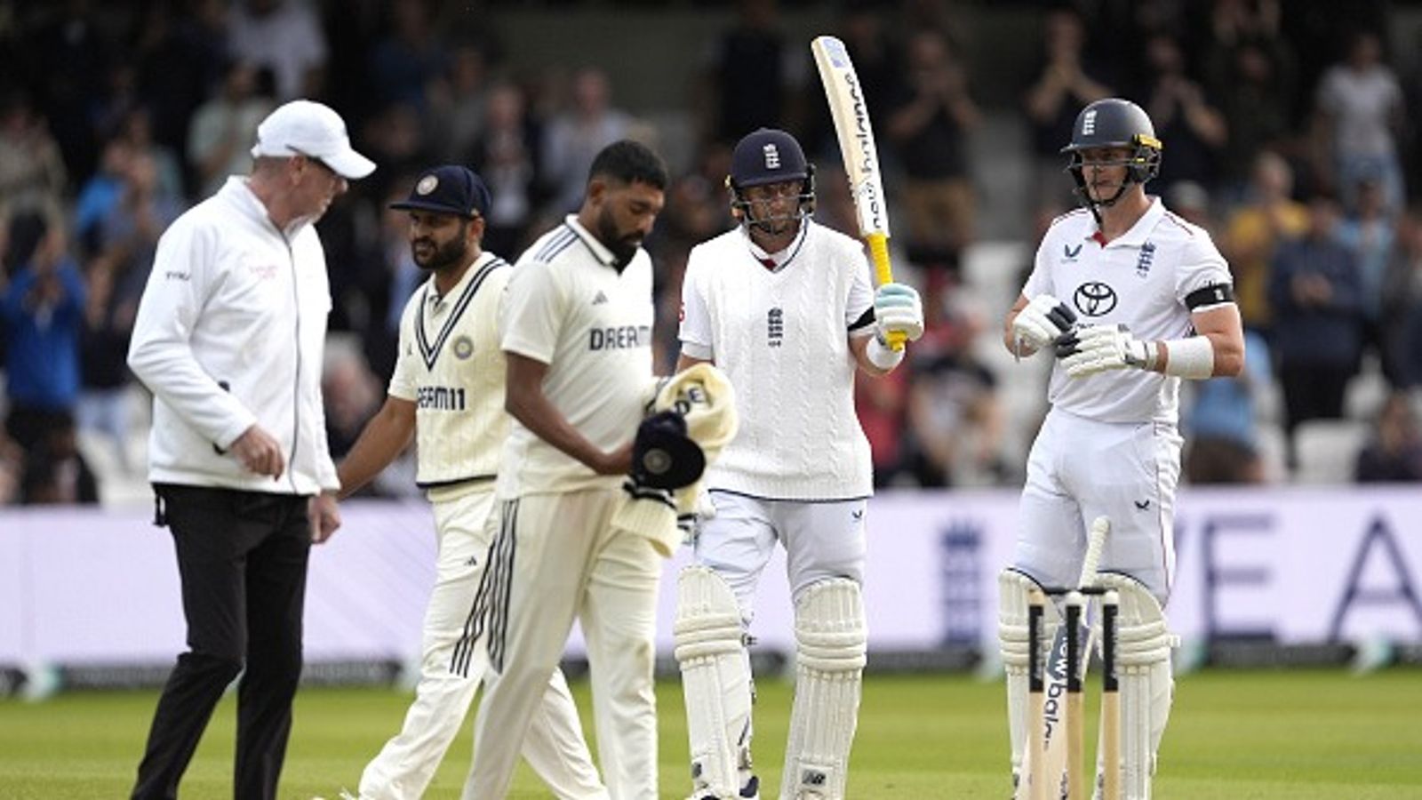 England stuns India with historic run chase of 371 despite India’s 835 runs and five centuries, lead Test series 1-0 England's Joe Root (centre) celebrates after reaching a half-century