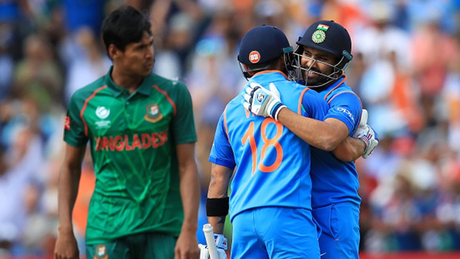 Rohit Sharma-led Team India to tour Bangladesh in August? BCB President provides crucial update on talks with BCCI: Report India's Rohit Sharma is congratulated on reaching his century by team-mate Virat Kohli during the ICC Champions Trophy, semi-final match at Edgbaston, Birmingham.