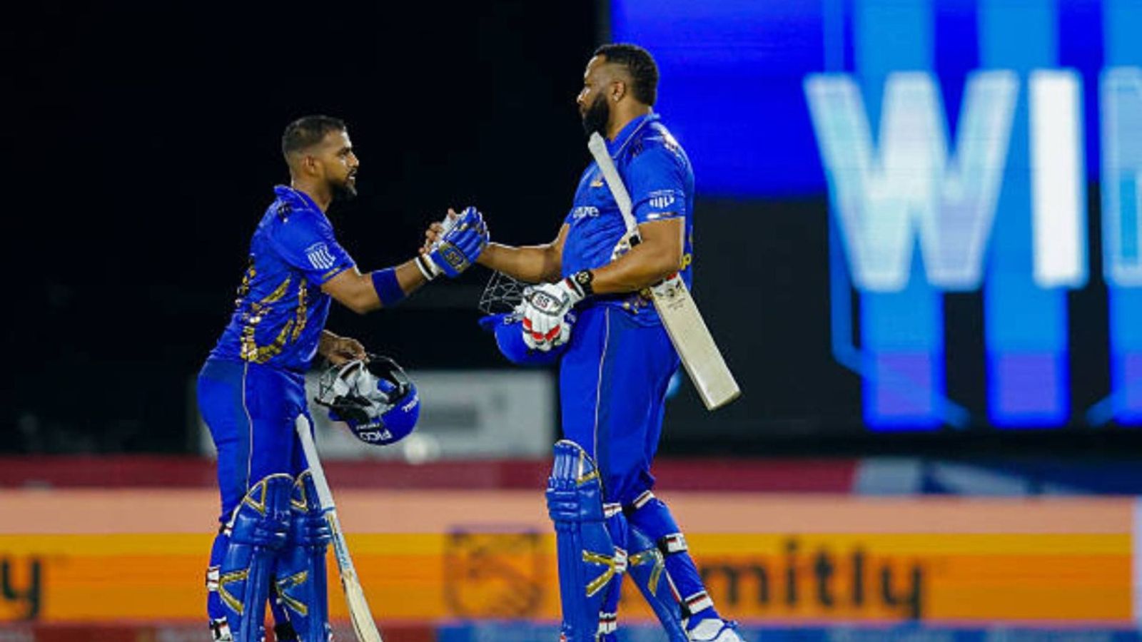 GT batter's valiant knock of 86 goes in vain as Trent Boult and Nicholas Pooran's heroics steer MI New York to 8-wicket win over LA Knight Riders Mumbai Indians New York Wicket Keeper Nicholas Pooran (29) and Mumbai Indians New York All Rounder Kieran Pollard (55) shake hands at the end of a Major League Cricket match between Los Angeles Knight Riders v Mumbai Indians New York