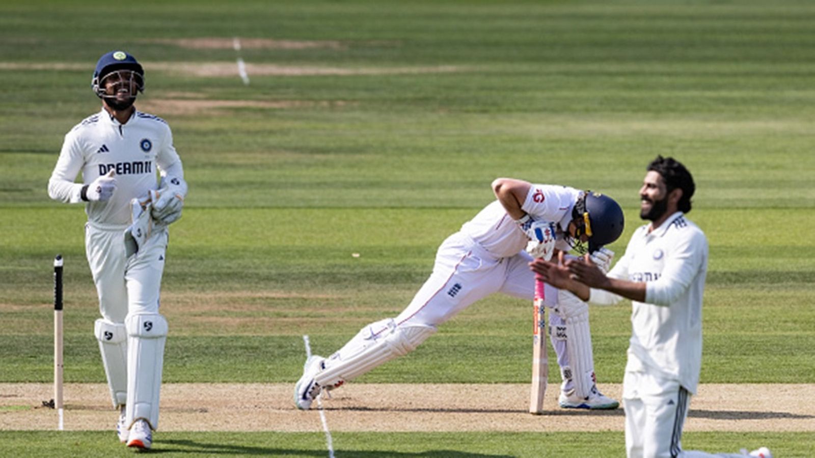 'This wasn't a surface where you could come out swinging': Ollie Pope explains why England batters abandoned Bazball approach in Lord's Test Substitute wicketkeeper Dhruv Jurel of India celebrates after taking the wicket of Ollie Pope of England off of the bowling of Ravindra Jadeja during day one of the 3rd Test at Lord's Cricket Ground on July 10, 2025.