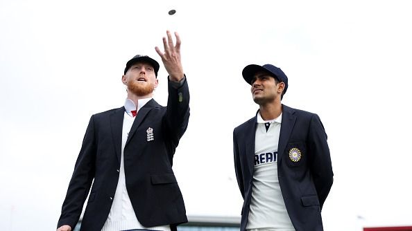 Ben Stokes of England and Shubman Gill of India are seen at the toss ahead of Day One of the 4th Rothesay Test Match between England and India at Emirates Old Trafford on July 23, 2025 in Manchester, England