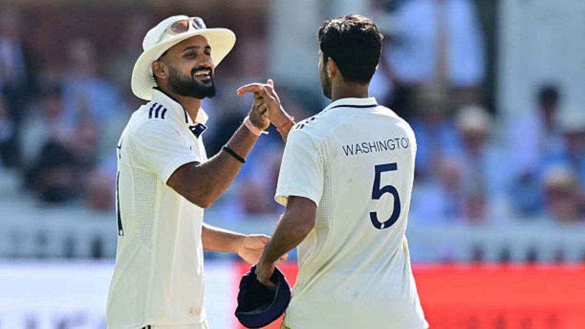 India's Akash Deep (L) congratulates India's Washington Sundar (R) on taking the final England wicket on the fourth day of the third cricket test match between England and India at Lord's cricket ground