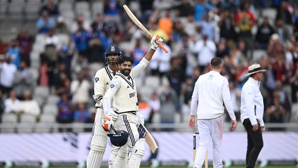 India batsman Ravindra Jadeja celebrates his century with Washington Sundar during day five of the 4th Test Match between England and India at Emirates Old Trafford on July 27, 2025 in Manchester, England.
