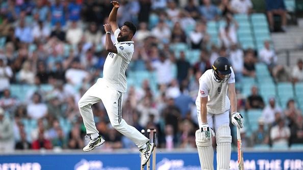 India's Mohammed Siraj (L) celebrates after taking England's Zak Crawley in this frame