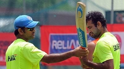 'Already knew whose hands it was in': Irfan Pathan breaks silence on Team India ouster, shares Gary Kirsten’s 'exact words' that pointed to MS Dhoni’s decision to drop him Indian cricket captain Mahendra Singh Dhoni (L) and teammate Irfan Pathan (R) inspect a bat during a training session in Colombo on September 22, 2012.