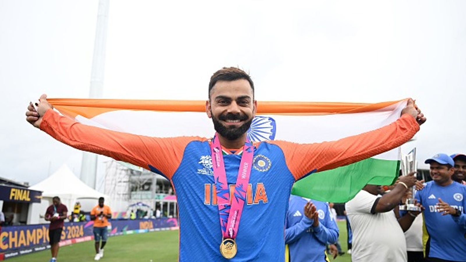 'We salute and honor the sacrifices of our heroes...': Virat Kohli pays heartfelt tribute to Indian Armed Forces on Independence Day Virat Kohli of India celebrates with a flag of India following the ICC Men's T20 Cricket World Cup West Indies & USA 2024 Final match between South Africa and India at Kensington Oval on June 29, 2024 in Bridgetown, Barbados.