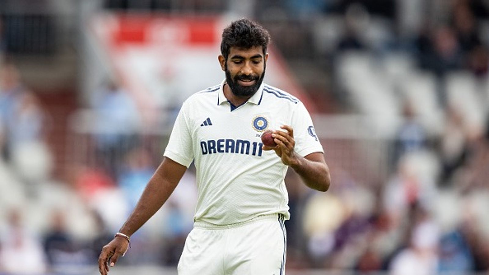 'Mohammed Siraj did it recently, but he can't do that for...': Harbhajan Singh breaks silence on Jasprit Bumrah's criticism for featuring in three Tests vs England Jasprit Bumrah of India inspects the ball during day four of the 4th Rothesay Test Match between England and India at Emirates Old Trafford on July 26, 2025 in Manchester, England.
