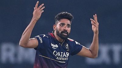 'Hanging on to Mohammed Siraj would make it difficult to...': RCB's massive revelation on releasing Hyderabad pacer before IPL 2025 mega auction Royal Challengers Bangalore's Mohammed Siraj gestures during the Indian Premier League (IPL) Twenty20 cricket match between Lucknow Super Giants and Royal Challengers Bangalore