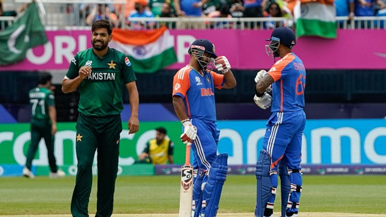 Exclusive | 'T20 game is on the day within matters of one over...': Sri Lanka great picks India as favourites to win Asia Cup 2025 Pakistan's Haris Rauf looks on as India's Rishabh Pant talks with teammate Suryakumar Yadav after Pant hit four during the ICC men's Twenty20 World Cup 2024