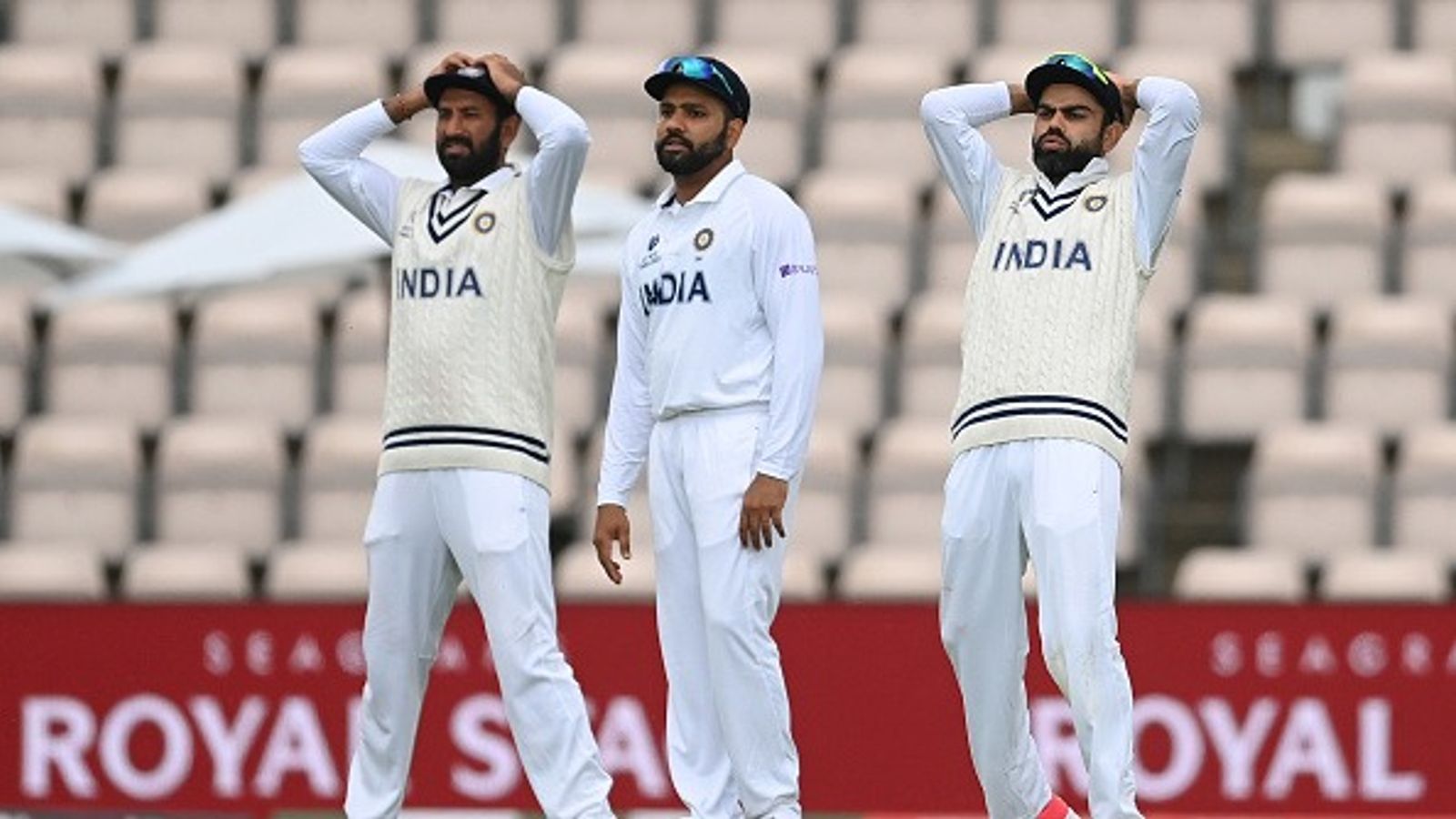 Former India star lashes out at BCCI over Cheteshwar Pujara's Test retirement and silent exit of Rohit Sharma and Virat Kohli Cheteshwar Pujara, Rohit Sharma and Virat Kohli of India react during Day 3 of the ICC World Test Championship Final between India and New Zealand at The Hampshire Bowl on June 20, 2021 in Southampton, England.