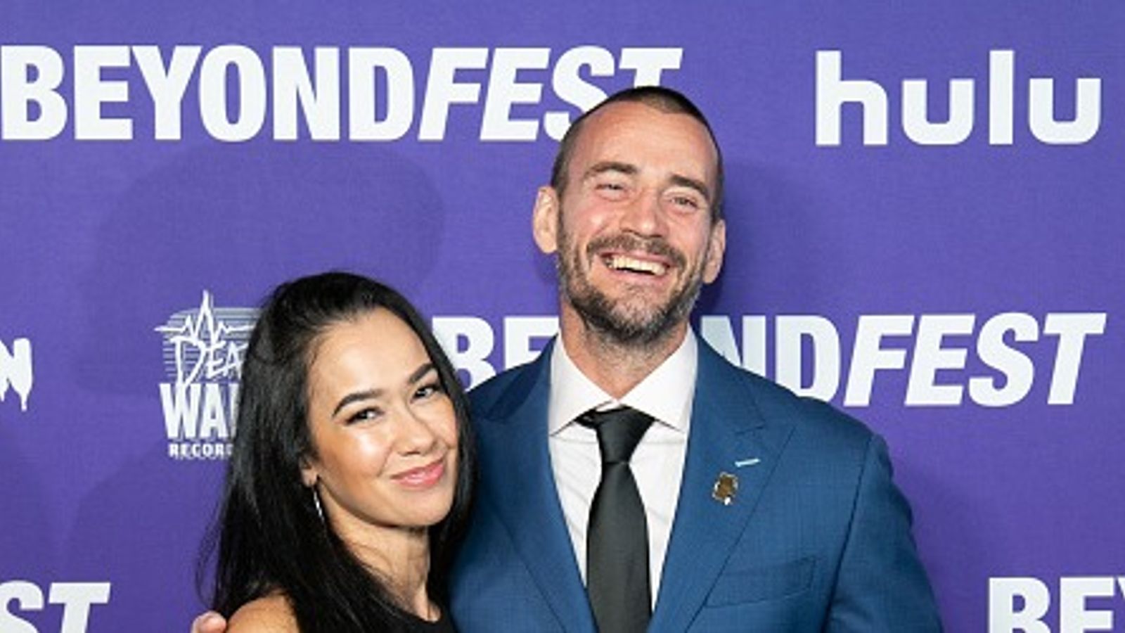 AJ Lee responds after CM Punk is attacked by female WWE superstar CM Punk with AJ Lee in the frame.