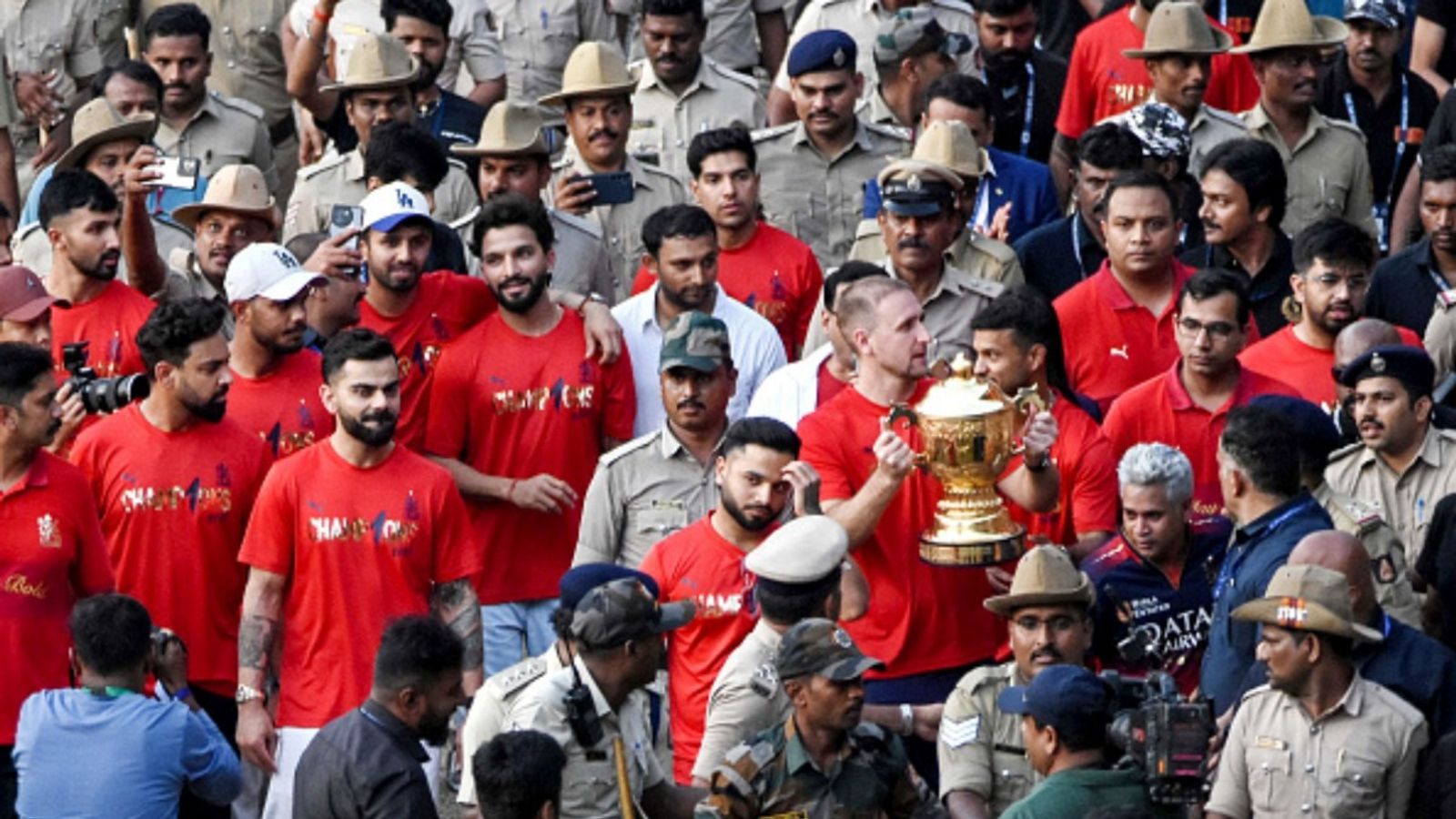 'The Silence wasn't Absence. It was Grief': RCB posts emotional message almost 3 months after devastating stampede during IPL 2025 victory celebrations RCB's Liam Livingstone (center R) holds the Indian Premier League (IPL) trophy as he celebrates with teammates at the M. Chinnaswamy Stadium in Bengaluru on June 4, 2025, a day after the team's victory in the tournament's final cricket match.