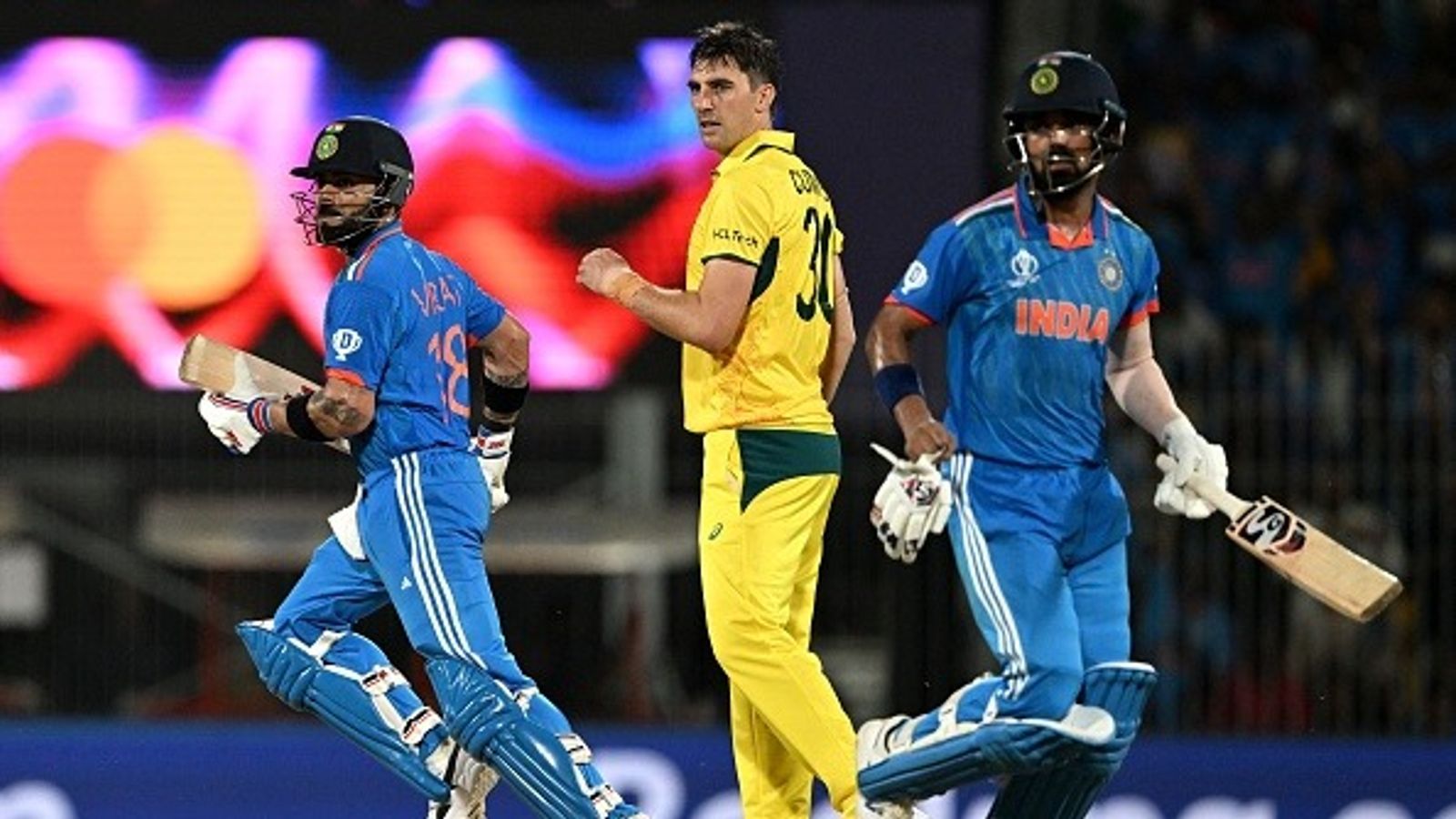 Massive blow for Australia, Pat Cummins likely to miss ODI series against India India's Virat Kohli (L) and KL Rahul run between the wickets past Australia's captain Pat Cummins (C) during the 2023 ICC Men's Cricket World Cup