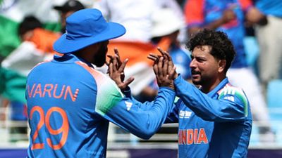'He may look blank on the outside, but...': Former India cricketer picks this star as Suryakumar Yadav-led side's 'X factor in Asia Cup 2025' India's Kuldeep Yadav (R) celebrates with teammate Varun Chakravarthy after taking the wicket of New Zealand's Rachin Ravindra during the ICC Champions Trophy one-day international (ODI) final cricket match between India and New Zealand