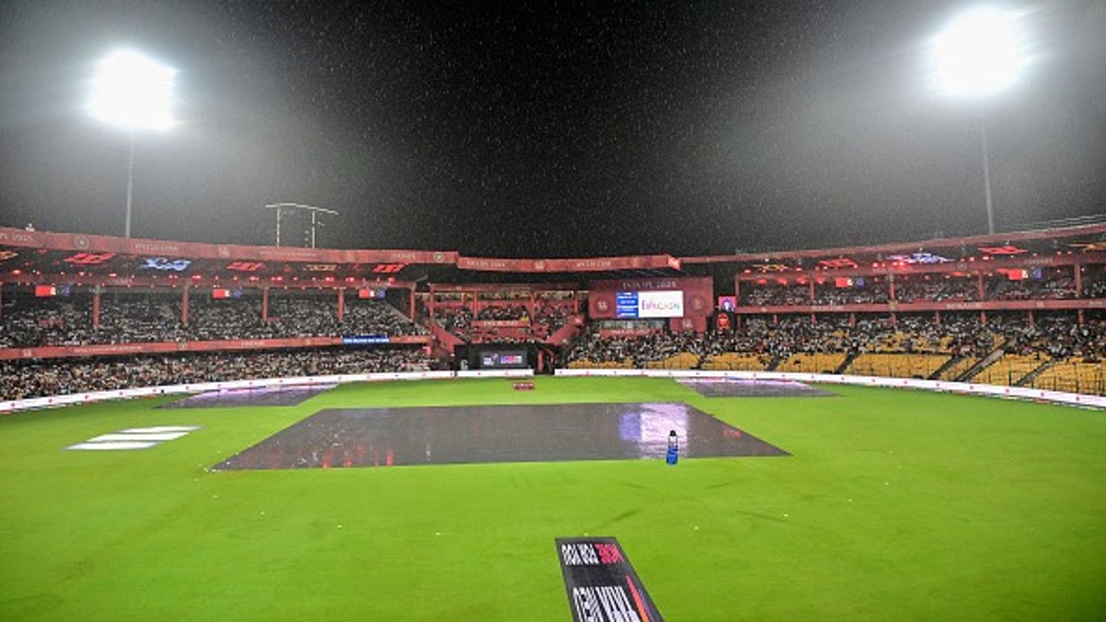 Bengaluru's M. Chinnaswamy Stadium set to host KSCA's pre-season red-ball tournament three months after stampede A general view of covers on the pitch as rain delays the start of the Indian Premier League (IPL) Twenty20 cricket match