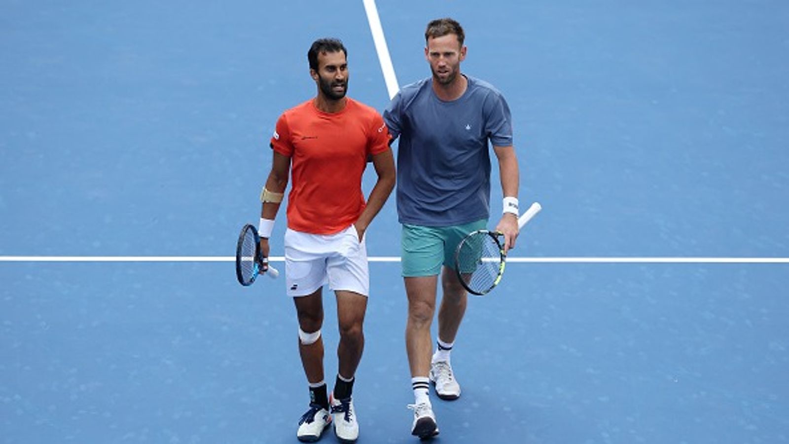 US Open 2025: Yuki Bhambri’s brilliant run ends in semis, denied first grand slam by gritty British opponents Yuki Bhambri of India (L) talks with partner Michael Venus of New Zealand against Joe Salisbury of the United Kingdom and Neal Skupski of the United Kingdom during their Men's Doubles Semifinal match