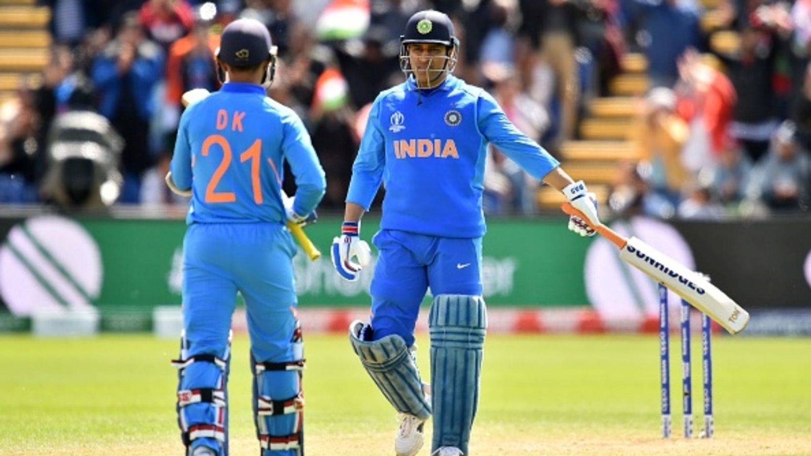 'MS Dhoni taught me a lot often in ways that weren't direct, but...': Dinesh Karthik feels former India captain's rise made him a 'chameleon' India's MS Dhoni (R) celebrates his century with teammate Dinesh Karthik during the 2019 Cricket World Cup warm up match against Bangladesh at Sophia Gardens stadium in Cardiff, South Wales, on May 28, 2019.