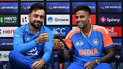 'Don’t think it’s ideal..to play in Abu Dhabi and stay in Dubai...': Rashid Khan questions Asia Cup 2025 scheduling ahead of Afghanistan's opener clash vs Hong Kong Afghanistan's team captain Rashid Khan (L) and India's captain Surya Kumar Yadhav (R) attend a press conference of the DP World Asia Cup 2025, at Dubai International Cricket Stadium
