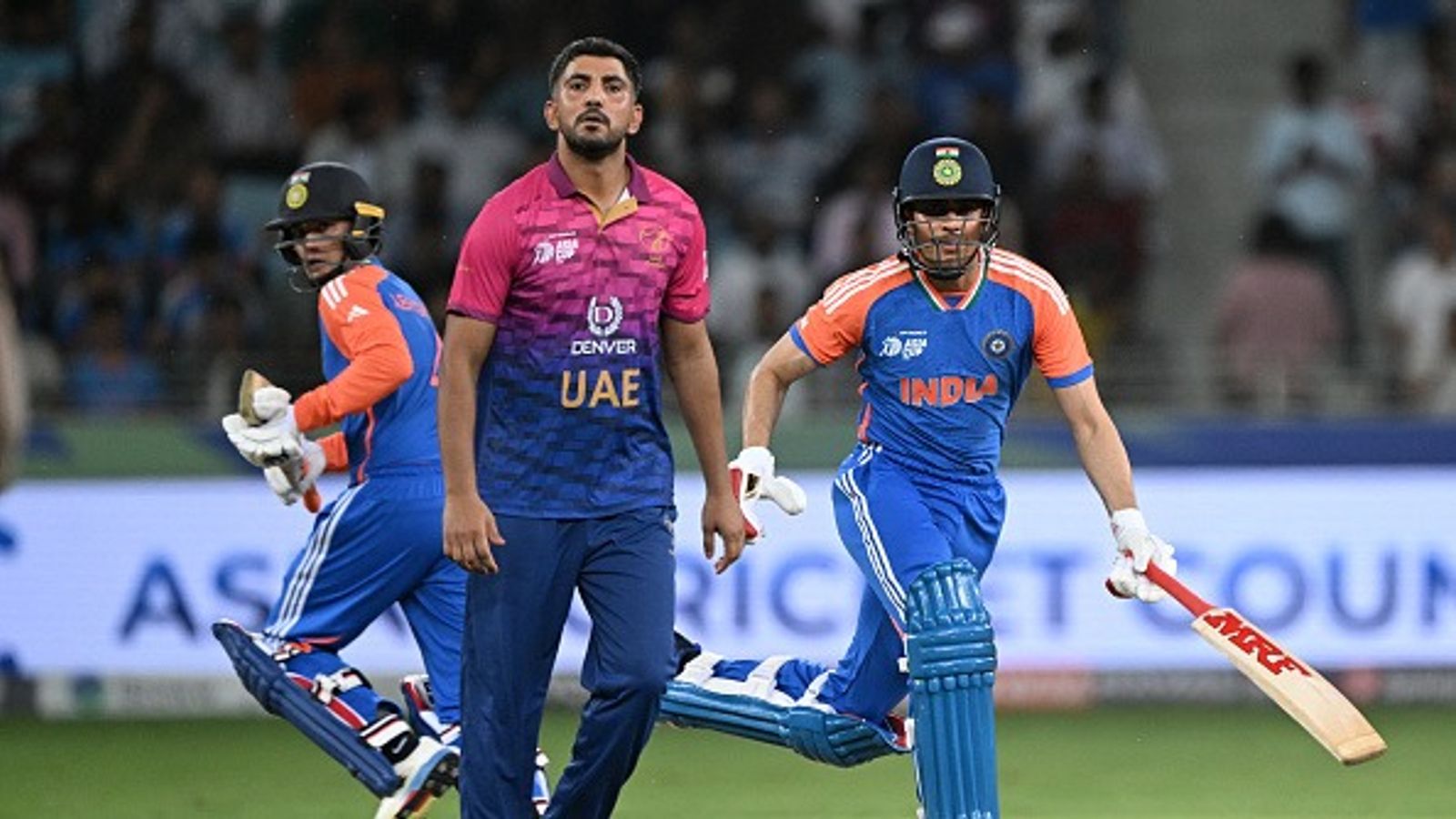 Asia Cup 2025: Suryakumar Yadav-led India script history, secure fastest chase in T20I history after bulldozing UAE in Asia Cup 2025 clash India's Shubman Gill (R) and Abhishek Sharma run between the wickets as UAE's bowler Junaid Siddique (C) watches during the Asia Cup 2025