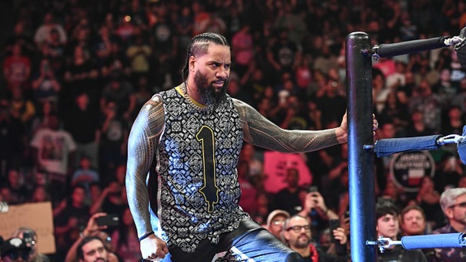 Jimmy Uso breaks character after giving Paul Heyman a new nickname on WWE RAW Jimmy Uso in the frame.