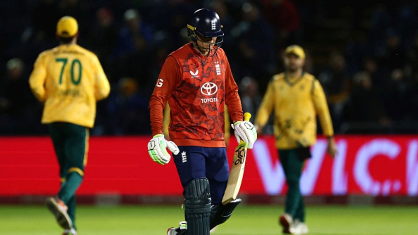 Jos Buttler left helpless in 5-over run chase as England lose rain-affected T20I opener by 14 runs after flurry of sixes from South African trio Jos Buttler of England leaves the field after losing his wicket, caught by Ryan Rickelton of South Africa off the bowling of Marco Jansen during the 1st T20I at Sophia Gardens on September 10, 2025 in Cardiff, Wales.