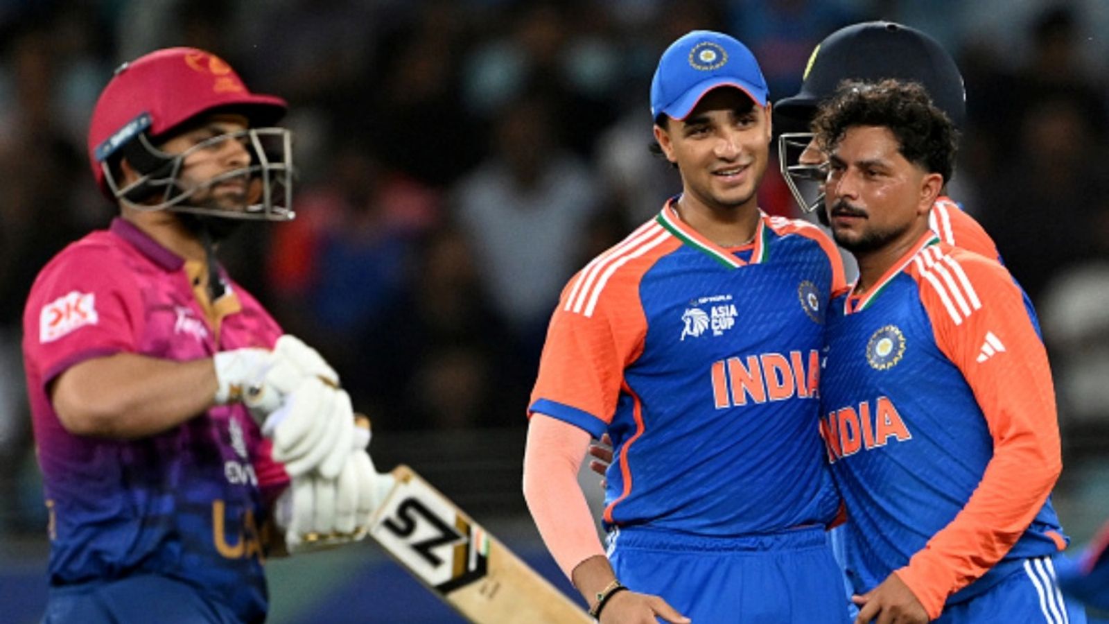 IND vs UAE: 'They never play such kind of bowlers. If Arshdeep can't make it to playing XI...': UAE coach Lalchand Rajput defends batting collapse vs India India's Kuldeep Yadav (R) celebrates with teammates after taking the wicket of UAE's Harshit Kaushik during the Asia Cup 2025 match at the Dubai International Stadium in Dubai on September 10, 2025.