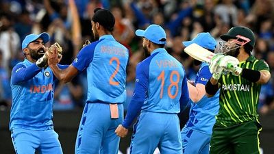 Kapil Dev advises Suryakumar Yadav-led India to 'concentrate only on their performance' against Pakistan in Asia Cup 2025 amid boycott calls over Pahalgam attack Dinesh Karthik (L) greets India's Arshdeep Singh (2nd L) as Pakistan's Mohammad Rizwan (R) walks off the field after his dismissal during the ICC men's Twenty20 World Cup 2022 cricket match between India and Pakistan at Melbourne Cricket Ground (MCG)