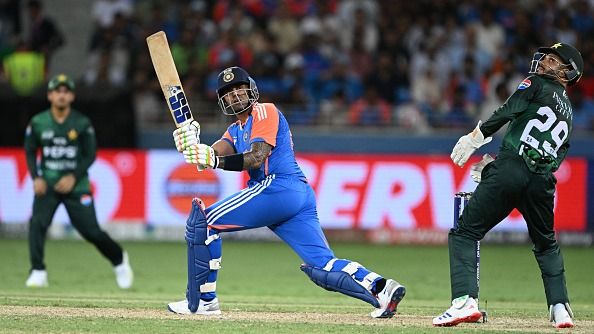 India's captain Suryakumar Yadav (C) plays a shot during the Asia Cup 2025 Twenty20 international cricket match between India and Pakistan at the Dubai International Stadium in Dubai on September 14, 2025.