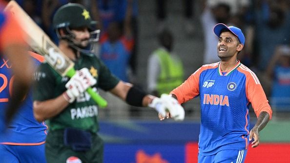 India's captain Suryakumar Yadav (R) celebrates after the dismissal of Pakistan's Sahibzada Farhan during their Asia Cup clash