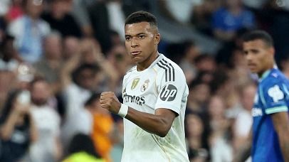 Kylian Mbappe celebrates scoring his team's first goal from the penalty spot during the UEFA Champions League first round day 1 football match between Real Madrid CF and Olympique de Marseille.