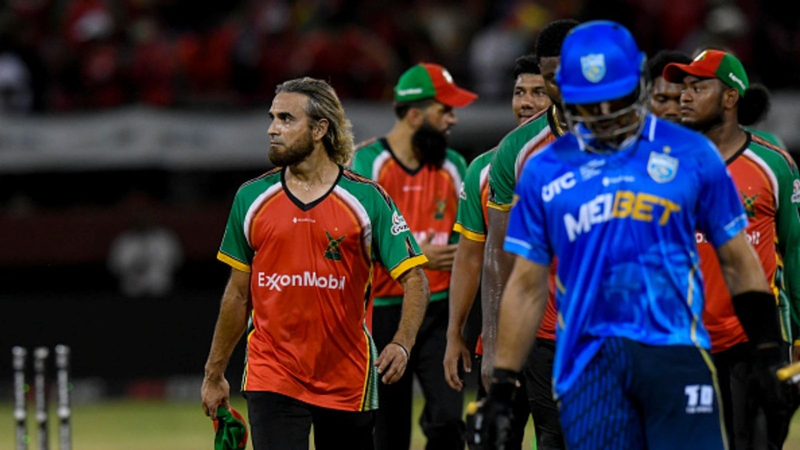 Reduced to 48/7 in run chase, Saint Lucia Kings put up a fight but Gudakesh Motie's 4-fer leads Guyana Amazon Warriors to 3rd consecutive CPL final Imran Tahir (L) of Guyana Amazon Warriors walk off the field after winning the CPL 2025 Qualifier 1 against Saint Lucia Kings at Guyana National Stadium on September 17, 2025.