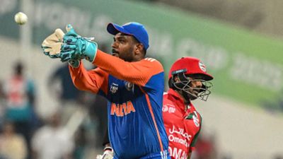 'Have to give credit to Oman...’: Sanju Samson praises Oman's grit as India secure unconvincing 21-run win in Asia Cup 2025 India's Sanju Samson (L) collects a throw as Oman's Aamir Kaleem reaches his crease during the Asia Cup 2025 Twenty20 international cricket match between India and Oman at the Sheikh Zayed Cricket Stadium