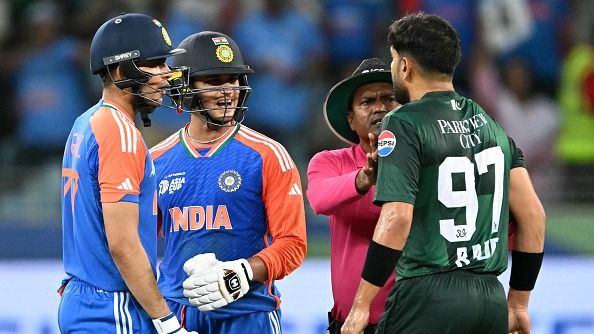 Pakistan's Haris Rauf (R) speaks with India's Abhishek Sharma (2L) as Shubman Gill watches during the Asia Cup 2025 Super Four Twenty20 international cricket match between India and Pakistan at the Dubai International Stadium in Dubai