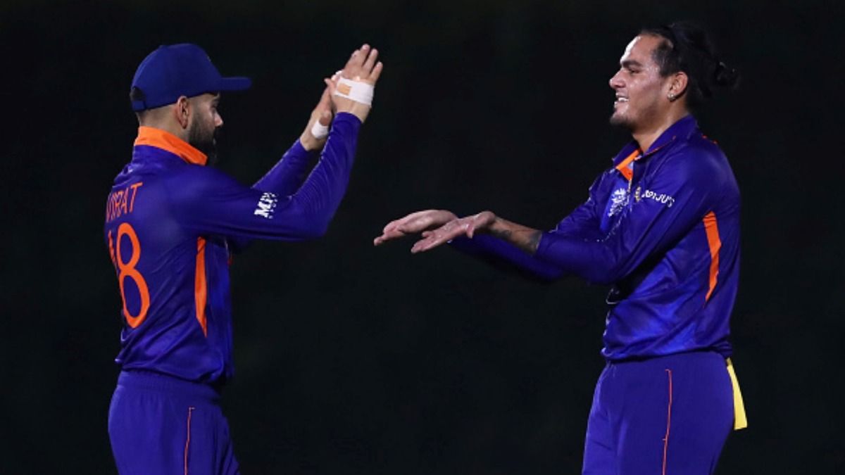 Absent from Indian side for 4 years, star player heads to Surrey for their final County Championship match, says 'I'm coming here to have an impact' Rahul Chahar of India celebrates the wicket of Dawid Malan of England with teammate Virat Kohli during the warm-up match prior to the ICC Men's T20 World Cup on October 18, 2021 in Dubai, United Arab Emirates.