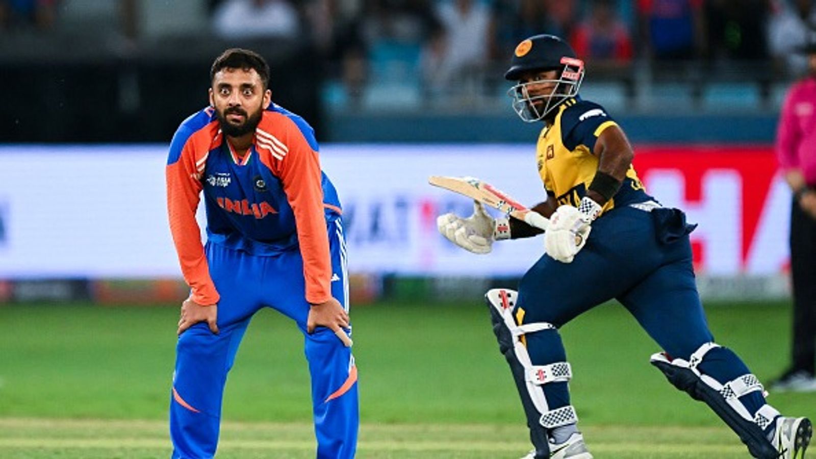 IND vs SL, Asia Cup 2025: Unbeaten India have the last laugh against Sri Lanka, enter final with nail-biting win in Super Over thriller India's Varun Chakravarthy reacts as Sri Lanka's captain Charith Asalanka takes a run during the Asia Cup 2025 Super Four Twenty20 international cricket match between India and Sri Lanka at the Dubai International Stadium in Dubai